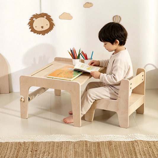 Side view of a young child sitting at the marine plywood activity table reading a book
