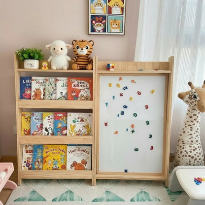 Front view of the solid pine bookshelf and magnetic whiteboard combination setup in a playroom with plush toys