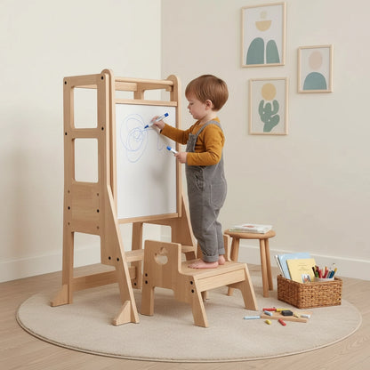 A toddler boy draws with a blue marker on the whiteboard panel of the solid pine standing stool