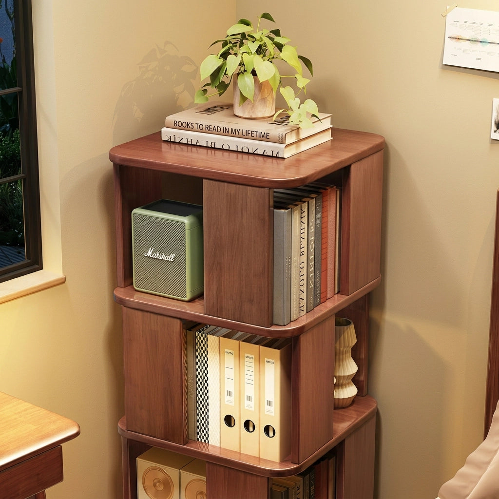Close-up view of a three-tier rotating bookshelf showing the warm solid rubberwood finish
