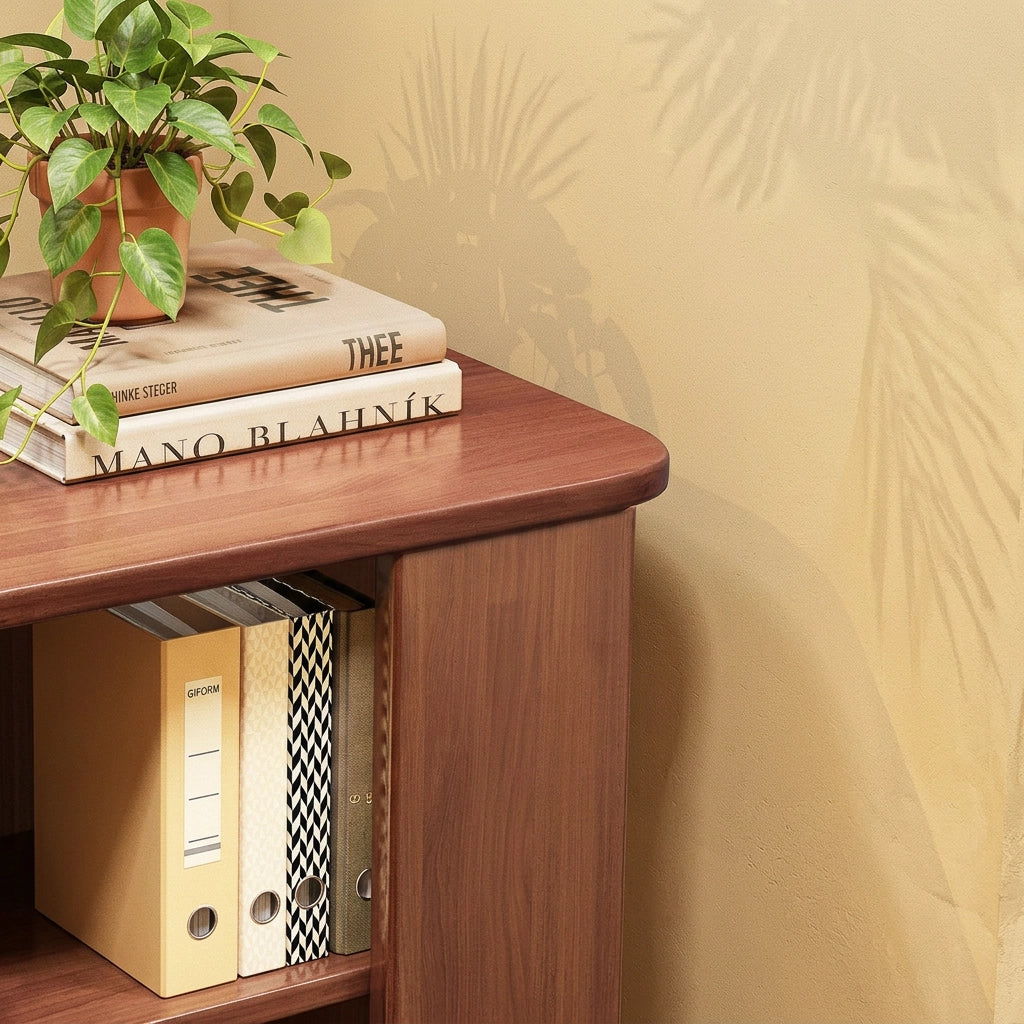 Detailed close-up of books and a potted plant on top of a solid rubberwood bookshelf