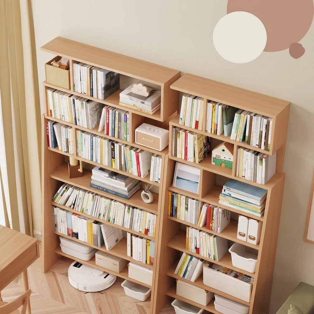 High-angle view of two pine-core engineered wood ladder bookshelves packed with children's books
