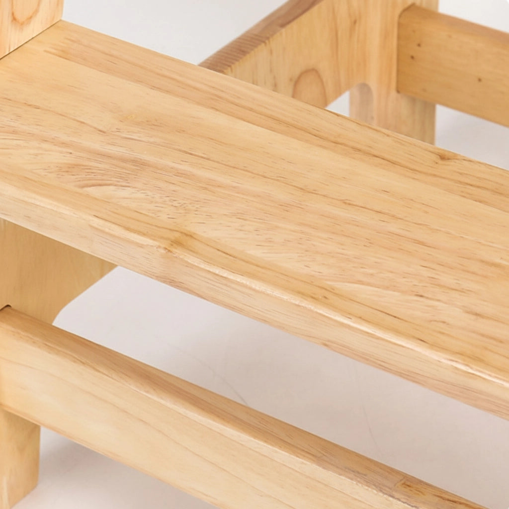 Close-up of the smooth step platform and natural wood grain on the solid rubberwood standing stool