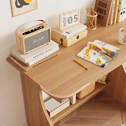 Close-up of the rounded corner and natural wood grain on the children's solid pine study desk surface