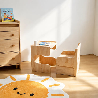 Angled view of the solid pine convertible table and chair set in a room corner