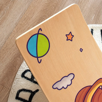 Close-up view of space-themed printed graphics on a smooth multi-layer plywood balance board