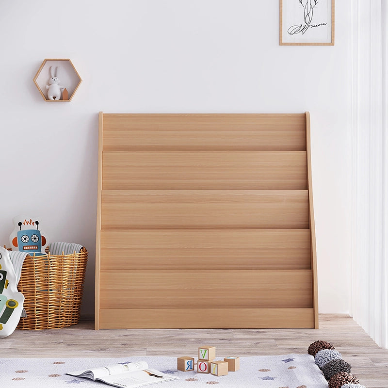 Front view of an empty five-tier curved front-facing kids bookshelf in a playroom setting