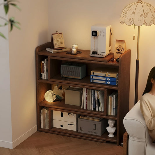 Solid rubberwood expandable floor bookshelf tucked into a room corner and filled with books and storage items