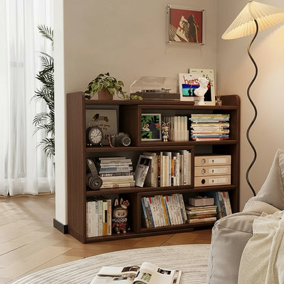 Solid rubberwood bookshelf holding books and toys next to a curved floor lamp in a living room