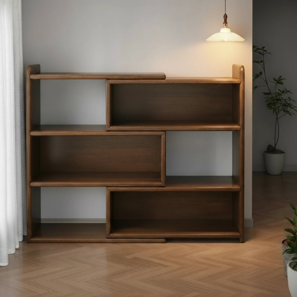 Front view of an empty solid rubberwood expandable floor bookshelf in a dimly lit room