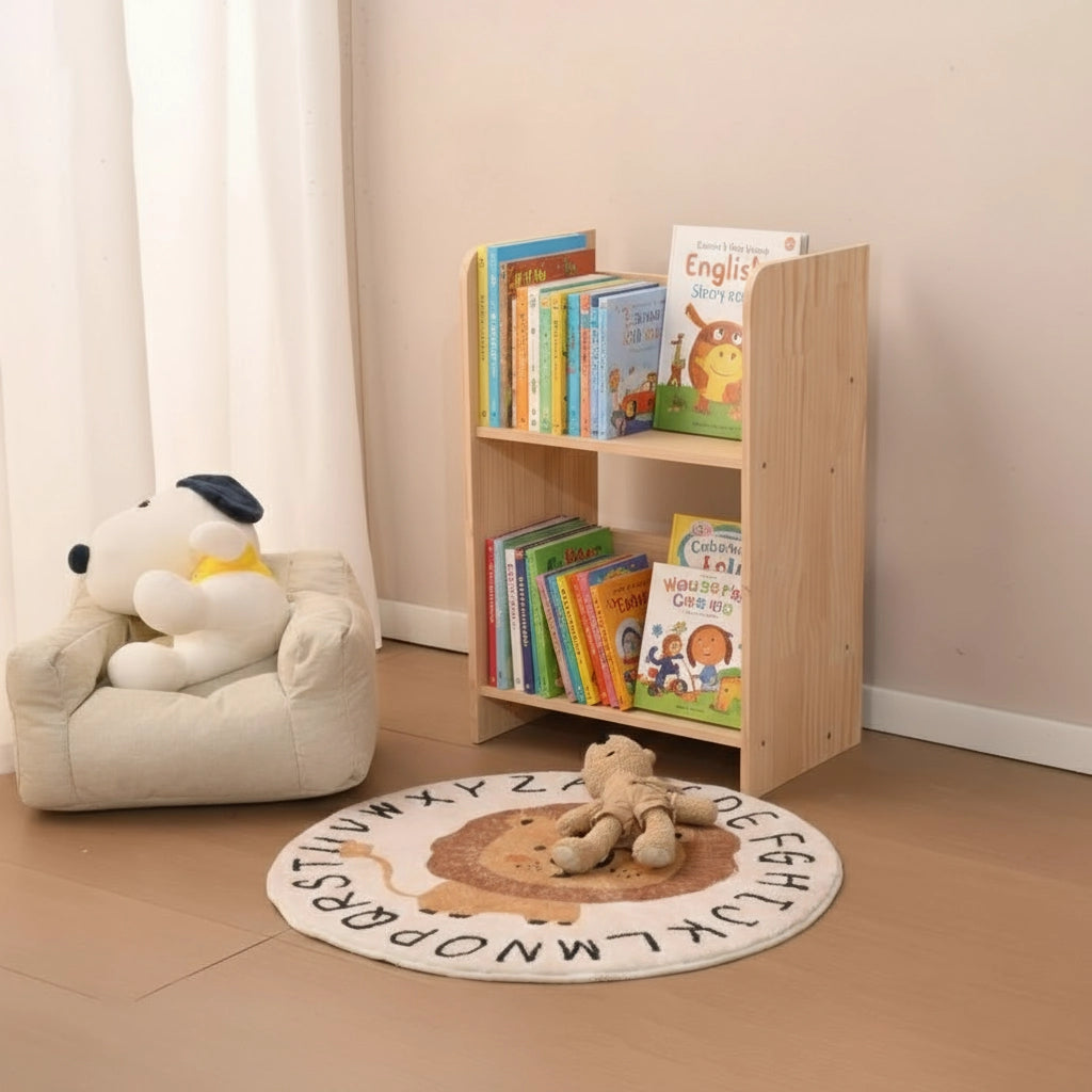Standalone small two-tier solid pine toddler bookshelf holding books next to a kids plush chair