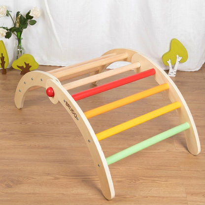 Reverse angled view of the toddler climbing arch showing its red, orange, yellow, and green rungs