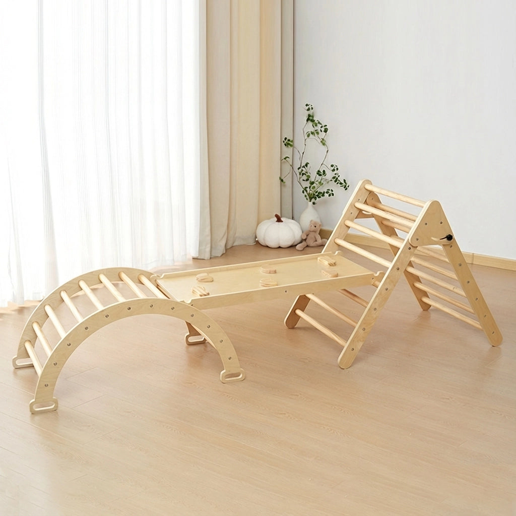 Empty natural plywood Montessori toddler climbing set with a triangle ladder, ramp, and arch rocker