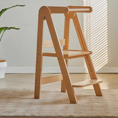 Angled view of an empty solid beech wood Montessori toddler standing stool on a light-colored rug