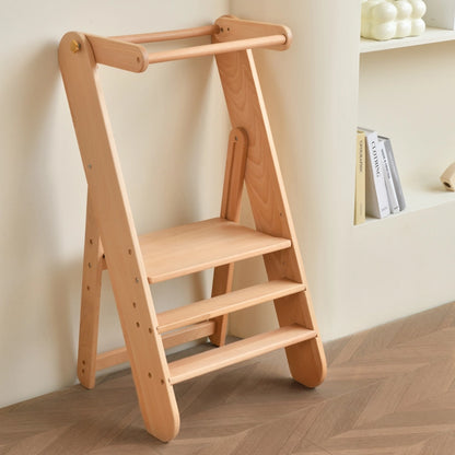 Three-quarter view of a solid beech wood Montessori toddler step stool in a room corner
