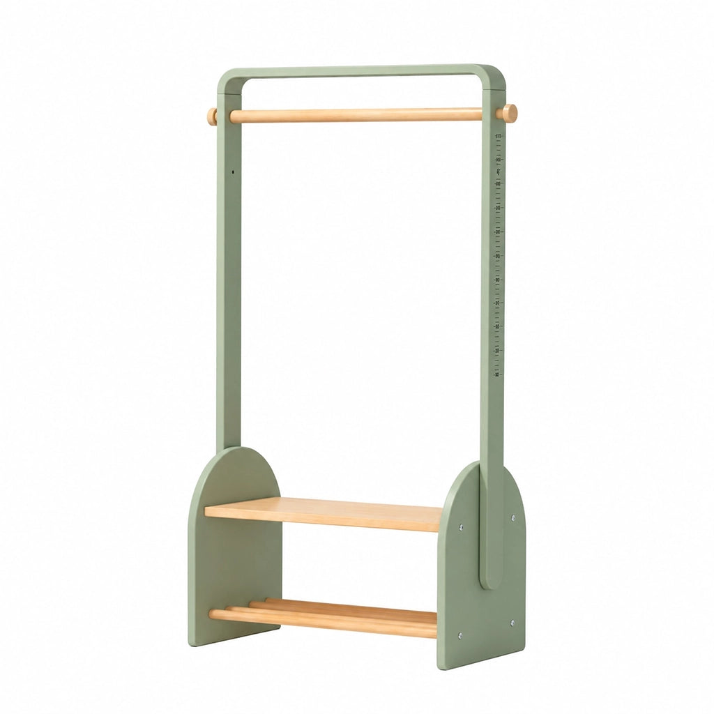 Angled view of a sage green children's clothing rack with a height scale and lower storage shelf