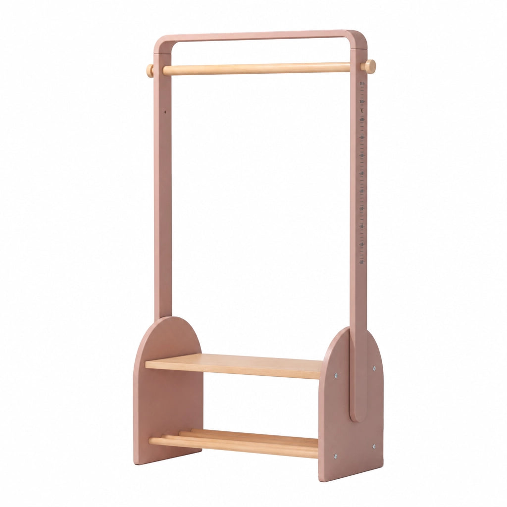 Angled view of an empty pink kids coat rack showing a built-in shoe bench and wooden hanging rod