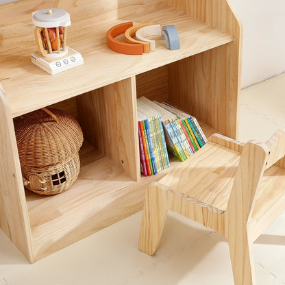Close-up view of the lower storage cubbies holding picture books and a mushroom-shaped woven basket