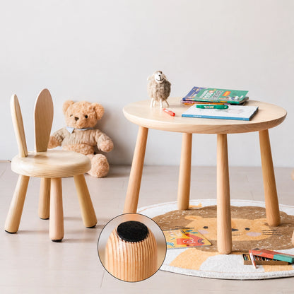A solid pine kids table and bunny chair with a circular inset highlighting the protective felt pad under the table leg