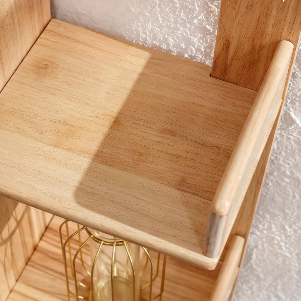 Top-down close view of an empty open shelf tier showing the natural wood finish and texture