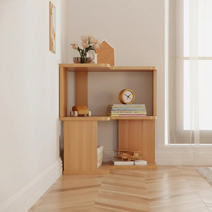 Low angled view of a two-tier L-shaped corner bookshelf on a herringbone wood floor beside a window