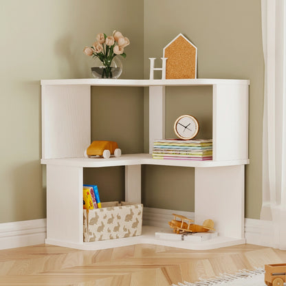 Angled view of a white two-tier L-shaped corner bookshelf holding books and children's toys