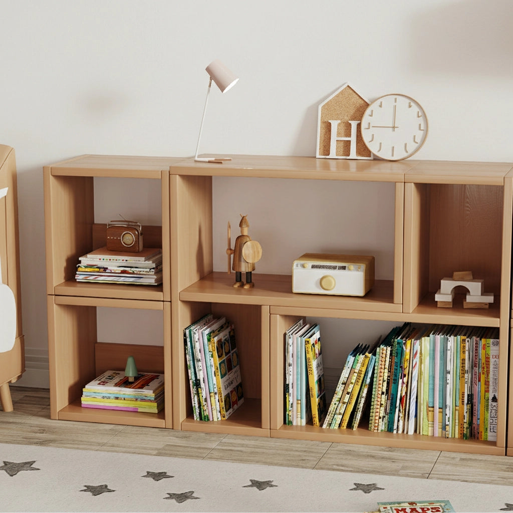 Front view of modular solid pine storage cubes holding books and decorative items beneath a small desk lamp