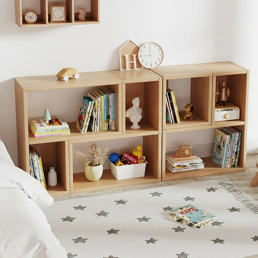 Three-quarter view of modular solid pine storage cubes arranged as low shelving units in a playroom filled with books and toys