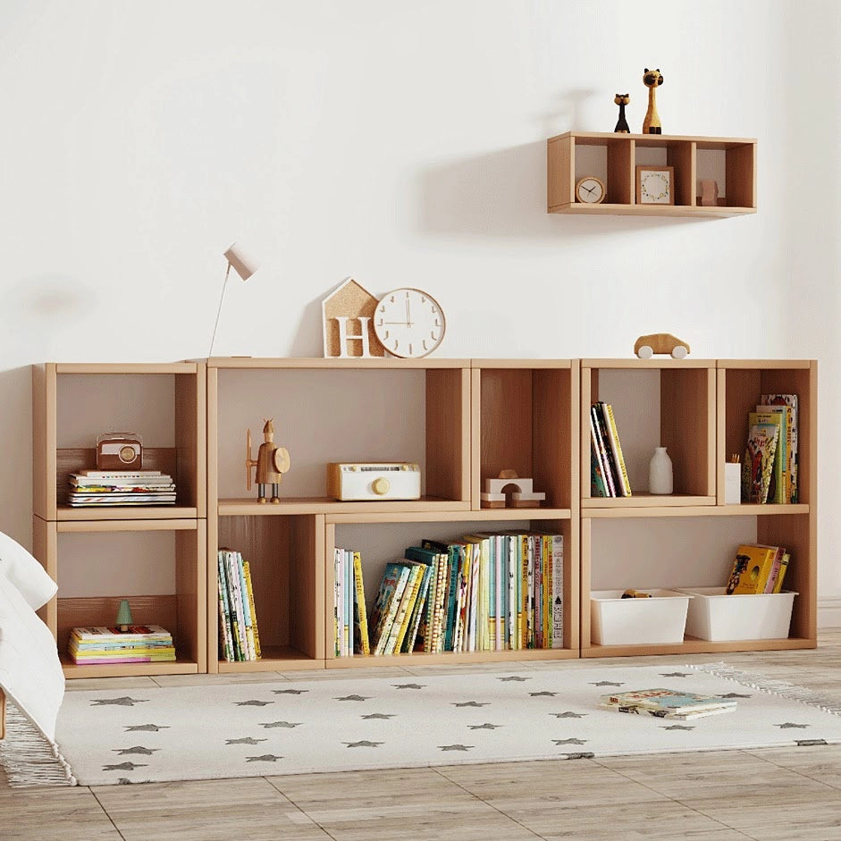 Wide view of solid pine Montessori storage cubes lined up against a wall with a matching wall shelf above