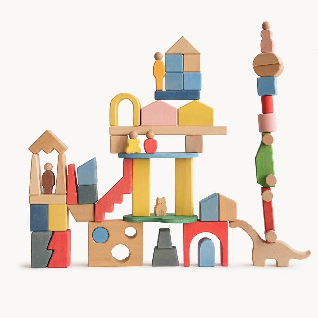Front view of a tall castle structure built with a solid wood Montessori city building blocks set