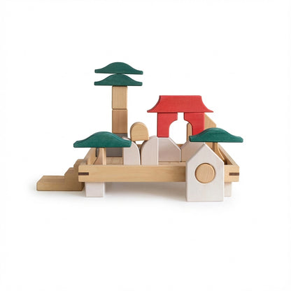 Architectural temple structure assembled from the solid wood blocks set on a clean white background