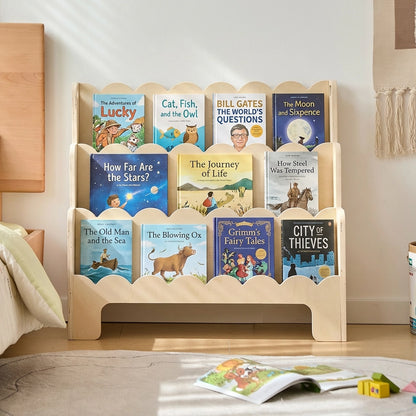 Direct front view of a plywood Montessori toddler bookshelf stocked with colorful children's picture books