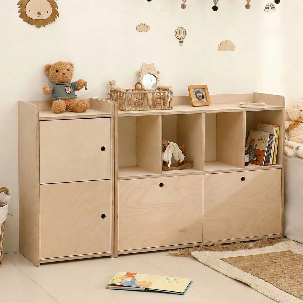 Two combined marine plywood Montessori modular toy organizer units with cubbies and doors in a room