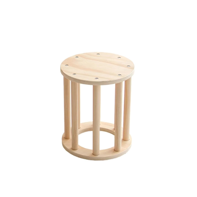 Small round wooden toddler stool with vertical support slats on a white background