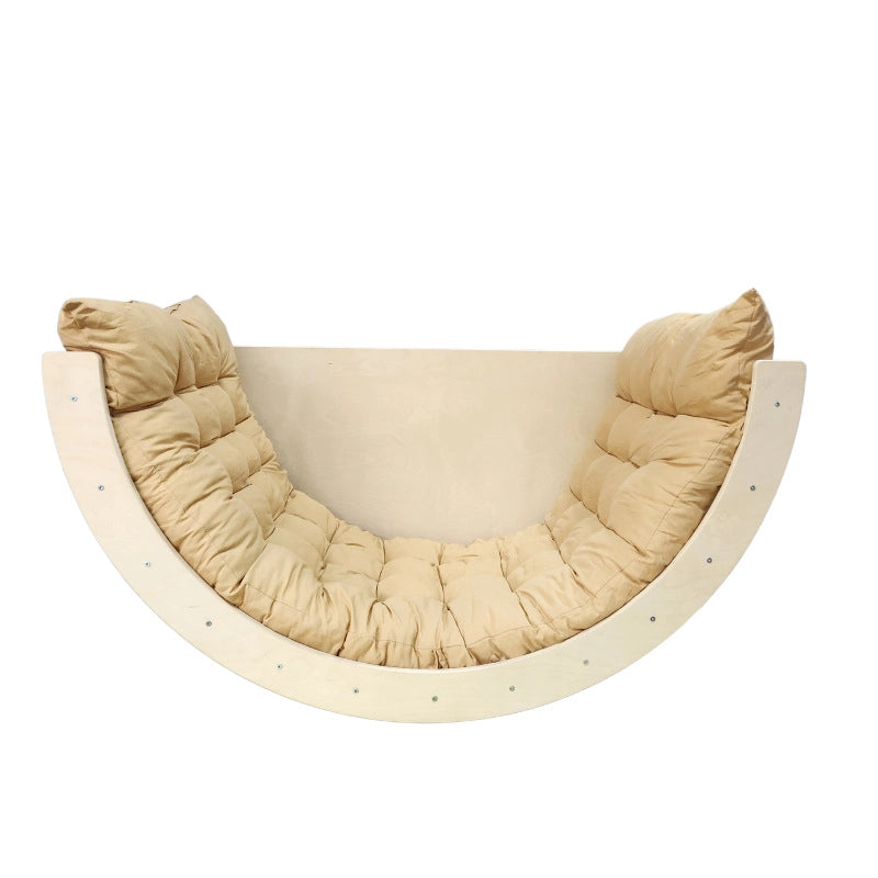 Natural wood Montessori rocker with a tufted yellow padded cushion on a white background