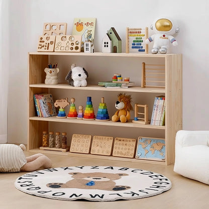 Angled three-quarter view of a three-tier solid pine toddler toy shelf filled with educational toys and puzzles