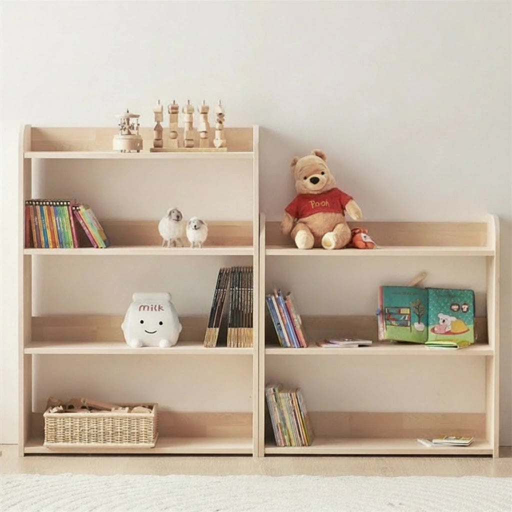 Front view of two solid pine Montessori toddler toy shelves side-by-side, holding books and a plush bear