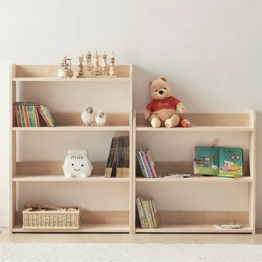 Front view of two solid pine Montessori toddler toy shelves side-by-side, holding books and a plush bear