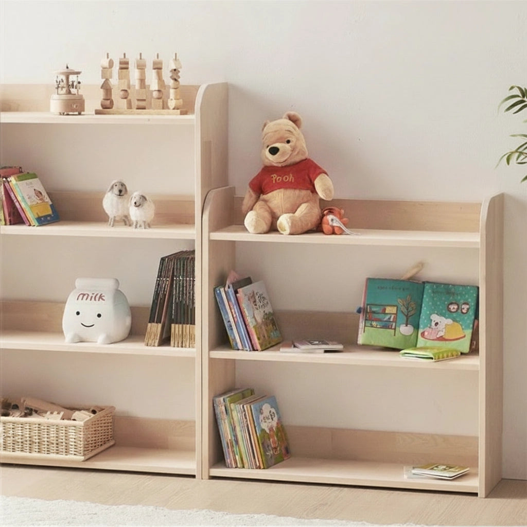 Close-up angled view of the open wooden shelves filled with colorful children's books and a plush bear