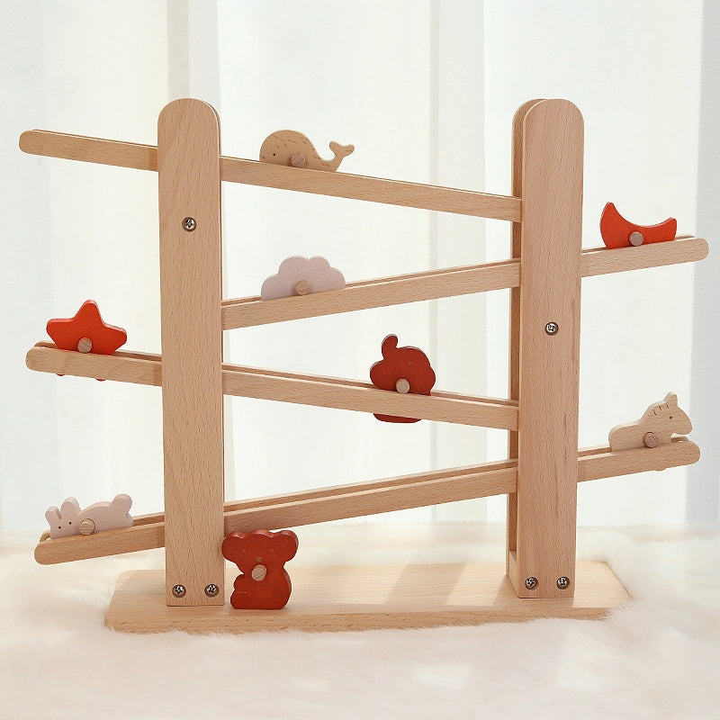 Front view of the fully assembled solid beech Montessori wooden animal flip track toy on a white rug
