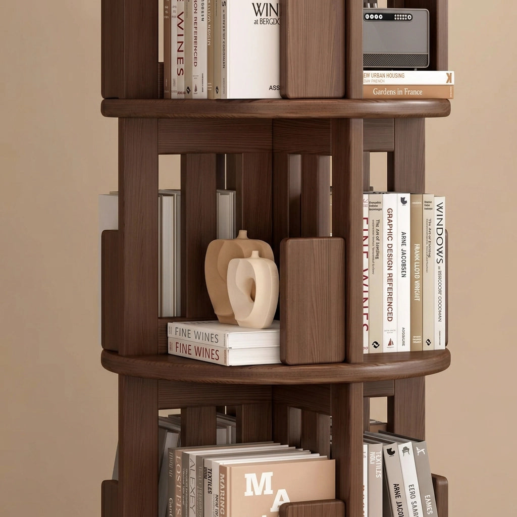 Detailed view of the middle tiers of a rotating wood bookshelf showing bookends and open compartments