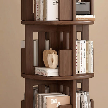 Detailed view of the middle tiers of a rotating wood bookshelf showing bookends and open compartments