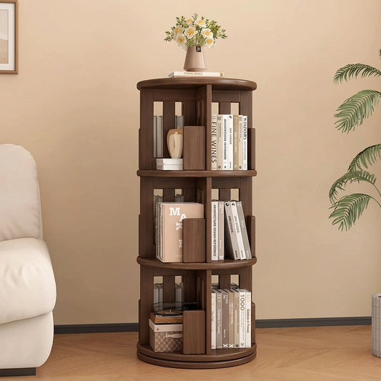Front view of a three-tier rotating kids bookshelf in a dark finish holding books with a vase on top