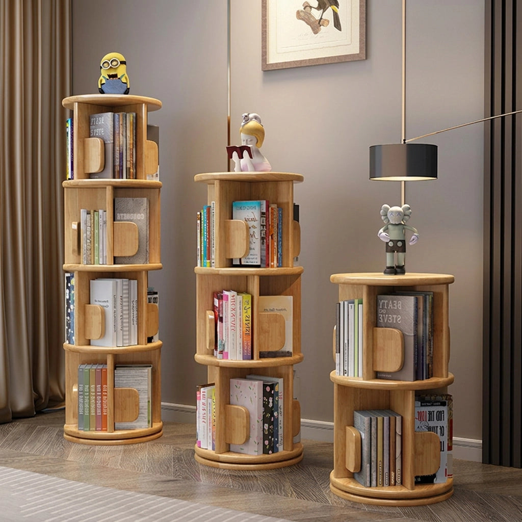 Three rotating solid wood kids bookshelves in a natural finish and varying heights filled with books