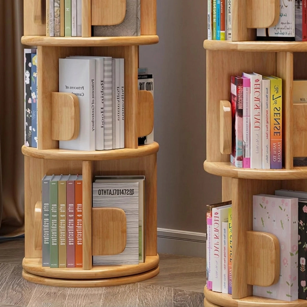 Detailed view of the open storage tiers and rounded wood dividers on a rotating solid wood kids bookshelf
