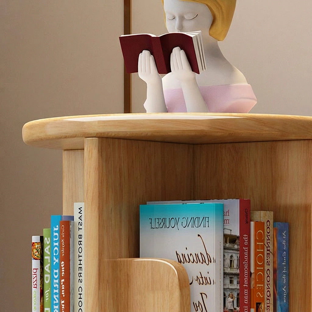 Close-up of the smooth top shelf of a natural solid wood rotating kids bookshelf holding a small figurine