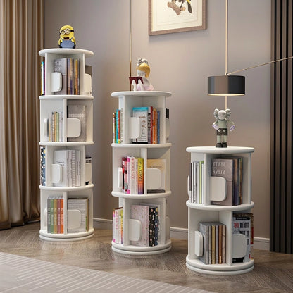 Three rotating solid wood kids bookshelves in a white finish and varying heights filled with picture books