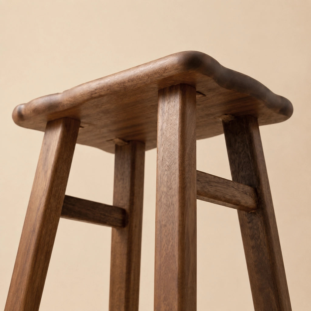 Low-angle view showing the solid wood legs and underside construction of the toddler stool