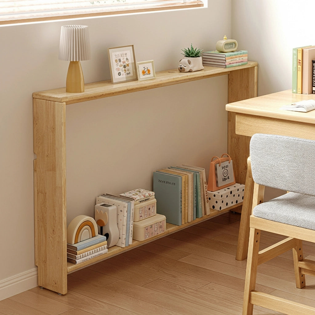 Angled view of a solid pine slim console bookshelf with an open frame design holding books on the bottom tier