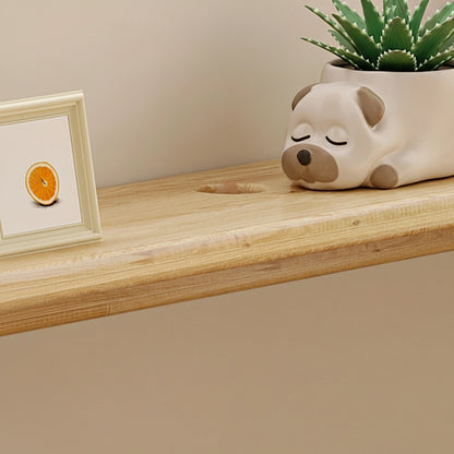 Close-up of the smooth top shelf surface showing a pre-drilled routing hole on the solid pine bookshelf